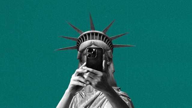 The statue of liberty takes a mirror selfie obscuring its face.