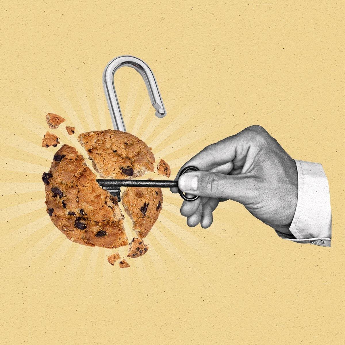 A hand uses a key to unlock a crumbling cookie.