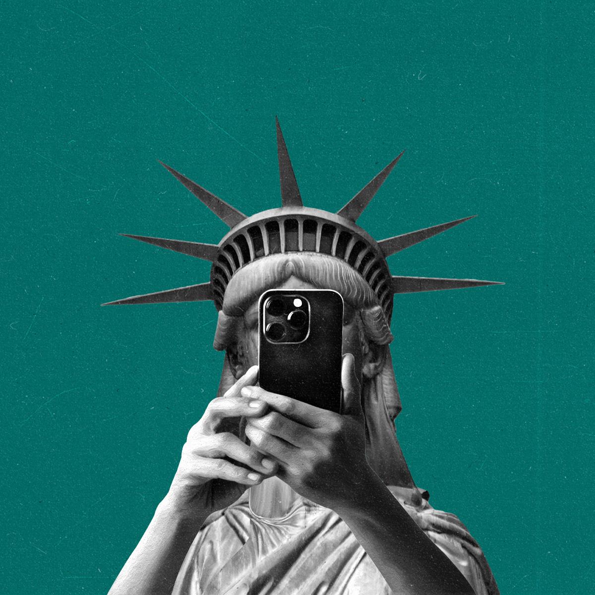 The statue of liberty takes a mirror selfie obscuring its face.