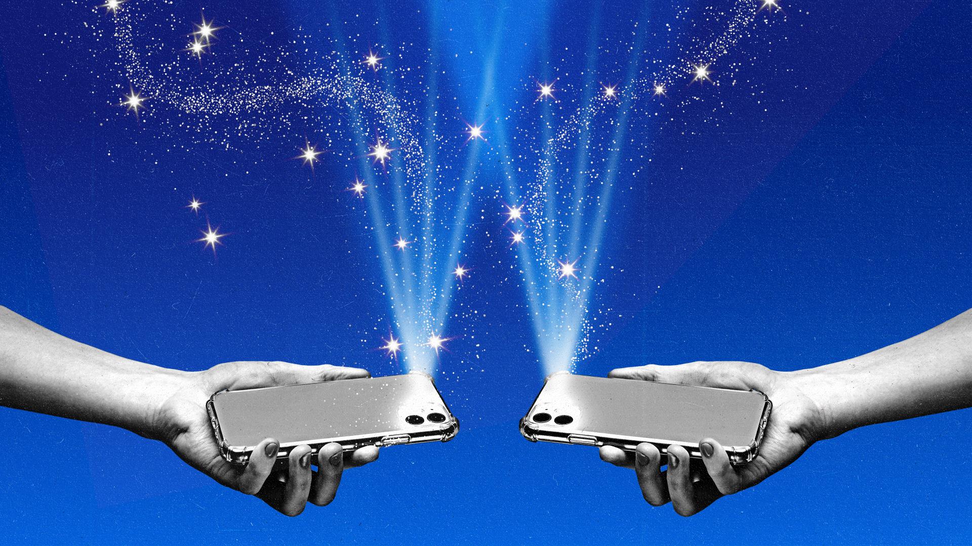 Two hands holding phones with their flashlights on illuminating a sky of stars.