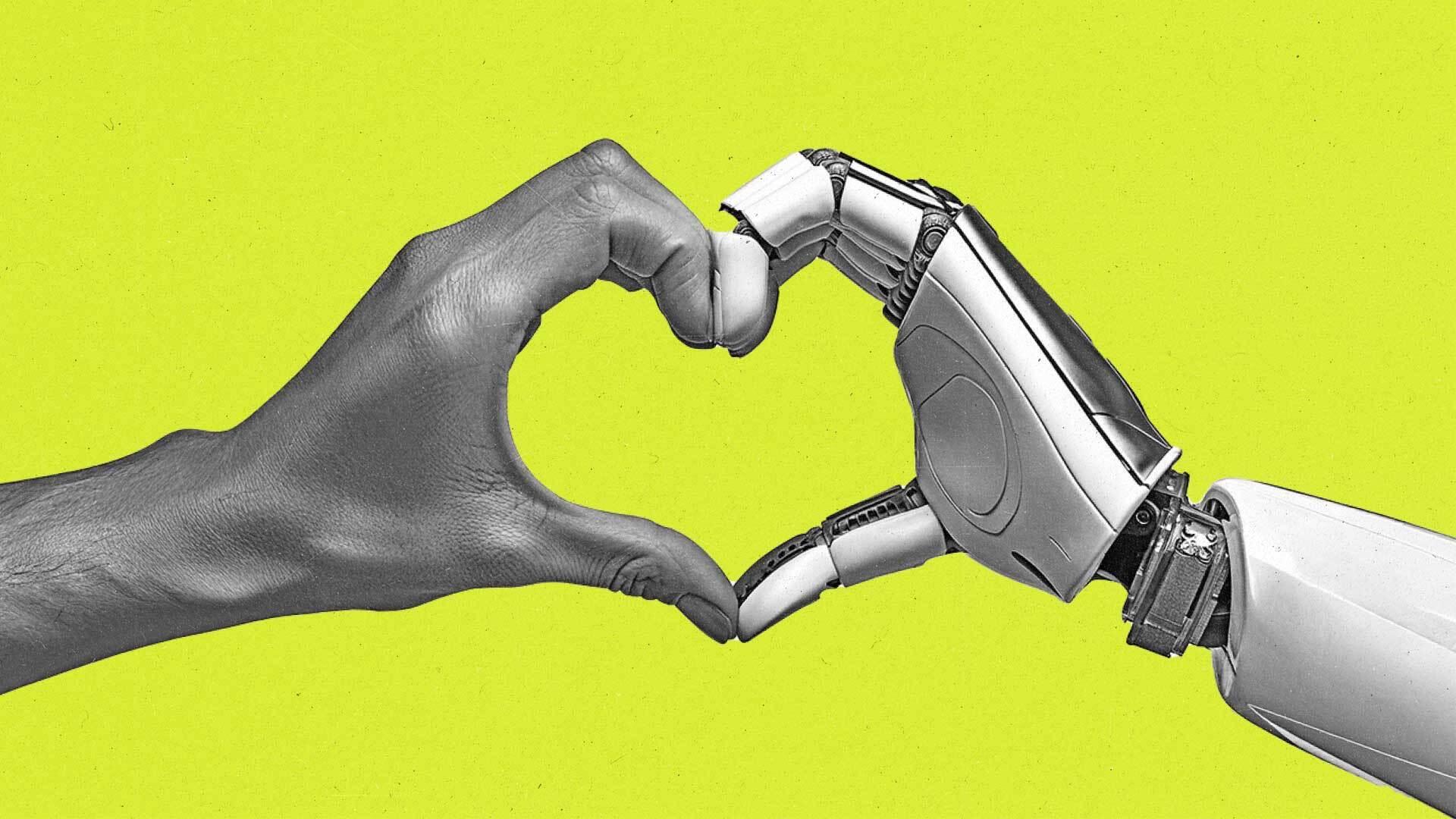 Human hand and robot hand join to form a heart shape.