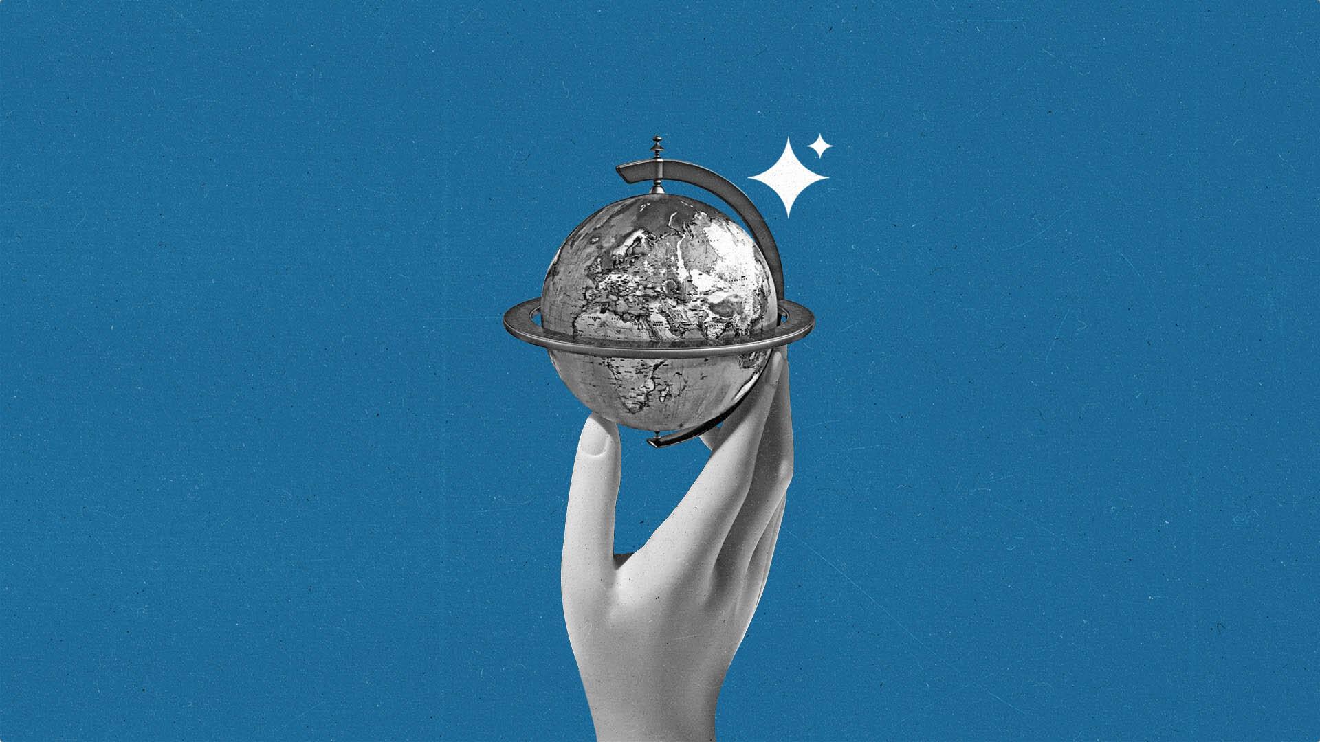 A doll hand holding a globe with AI sparkles floating above it.