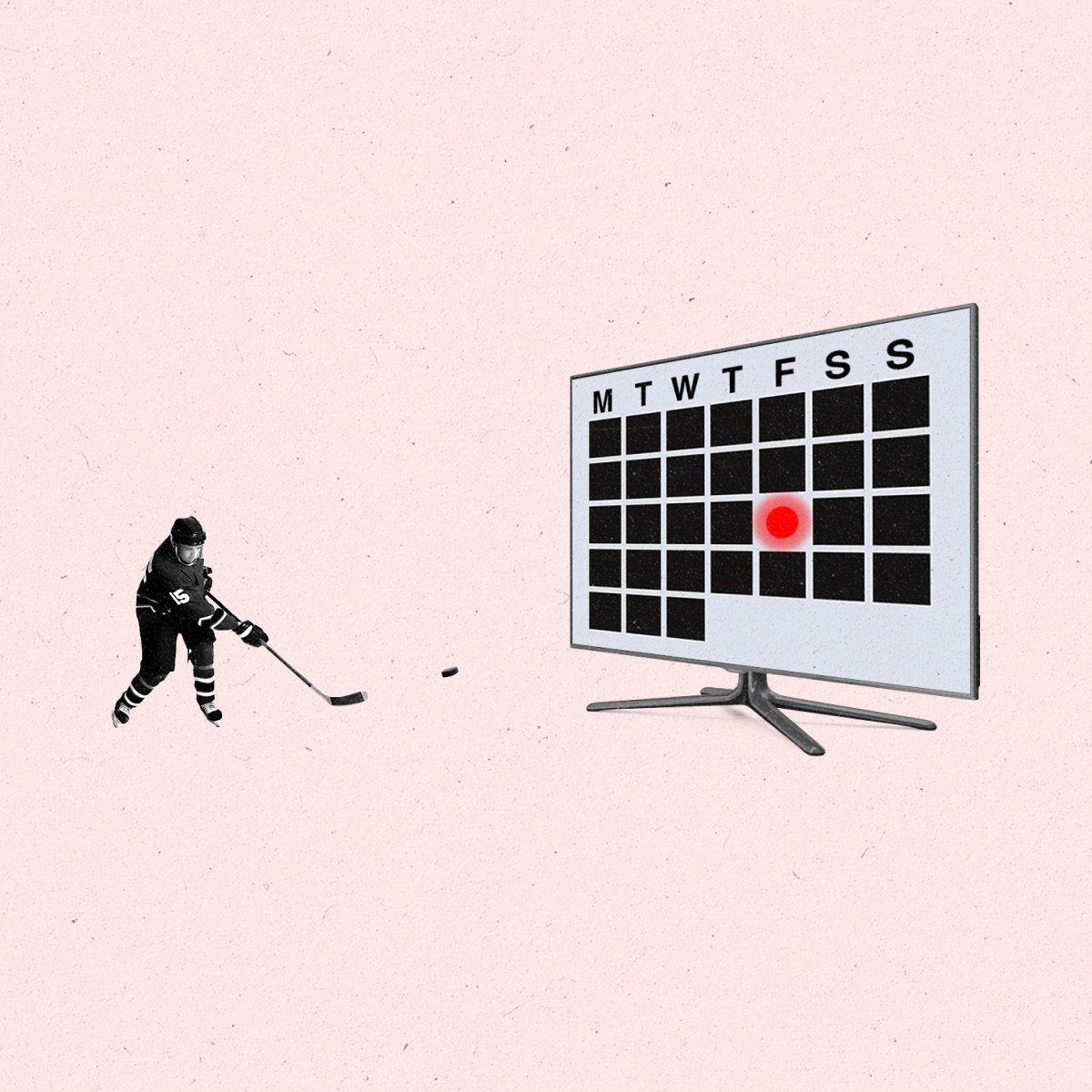 An ice hockey player hits a puck into a TV with a calendar on it.