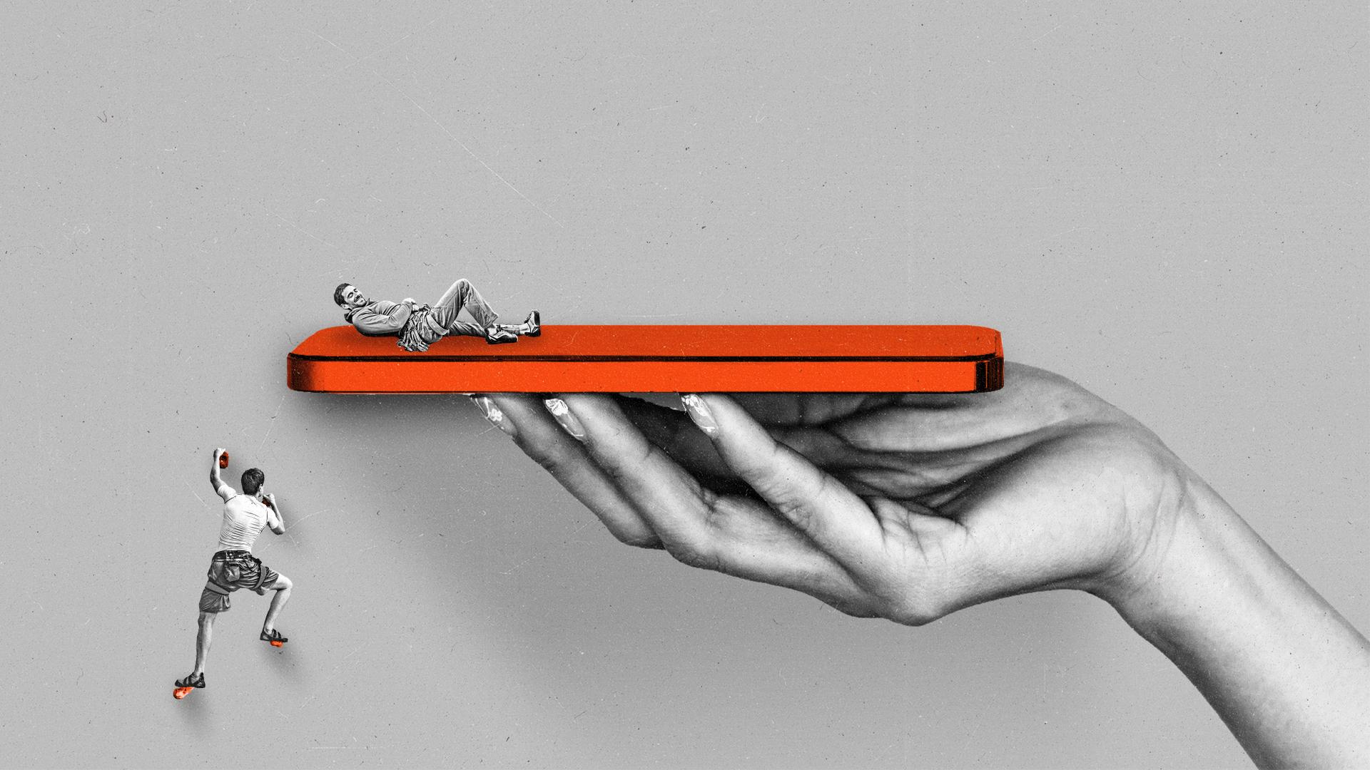 A rock climber climbs towards another rockclimber reclining on a giant phone being held by a hand.