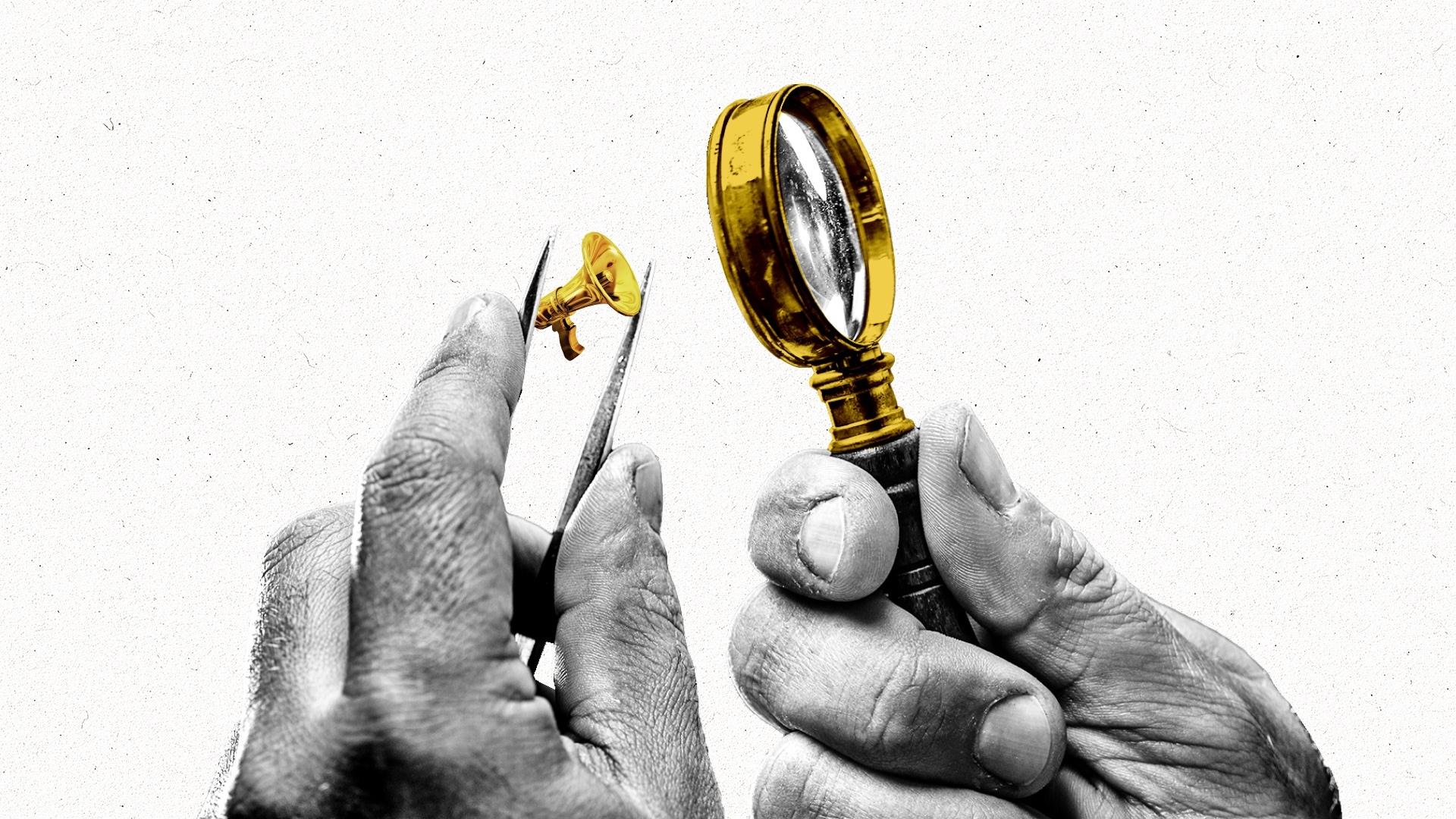 Hands holding tweezer and magnifying glass inspecting gold megaphone.