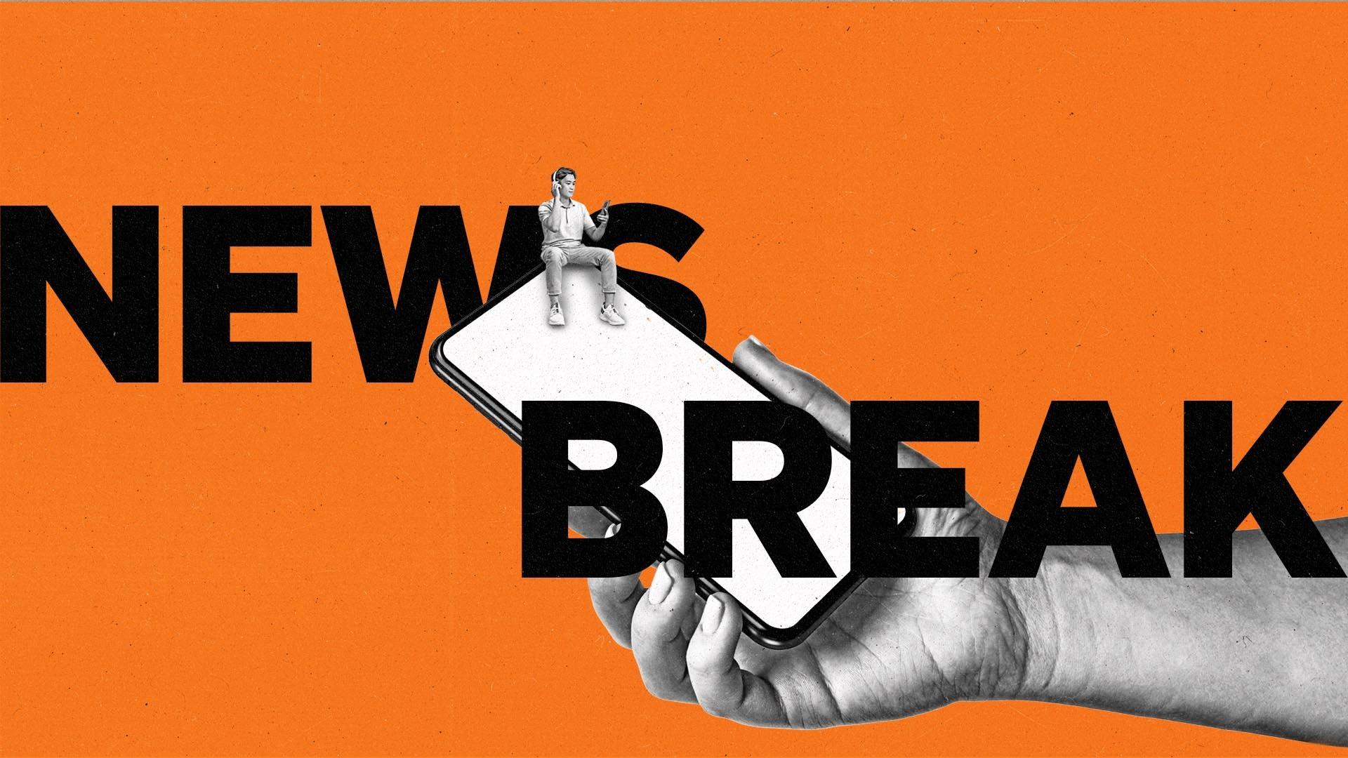 A hand holds a smartphone with a man sitting on top of it inbetween the words News Break