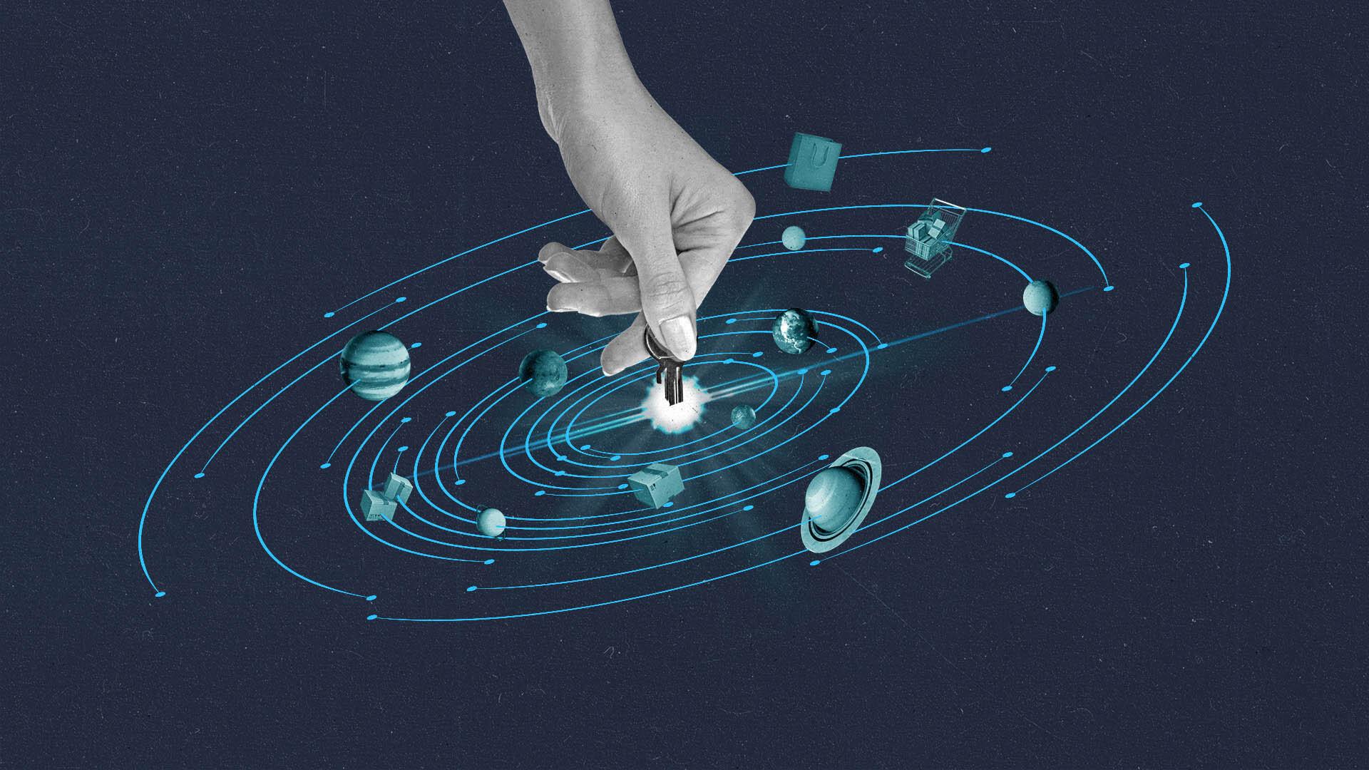A hand puts a key into the center of a universe solar system.