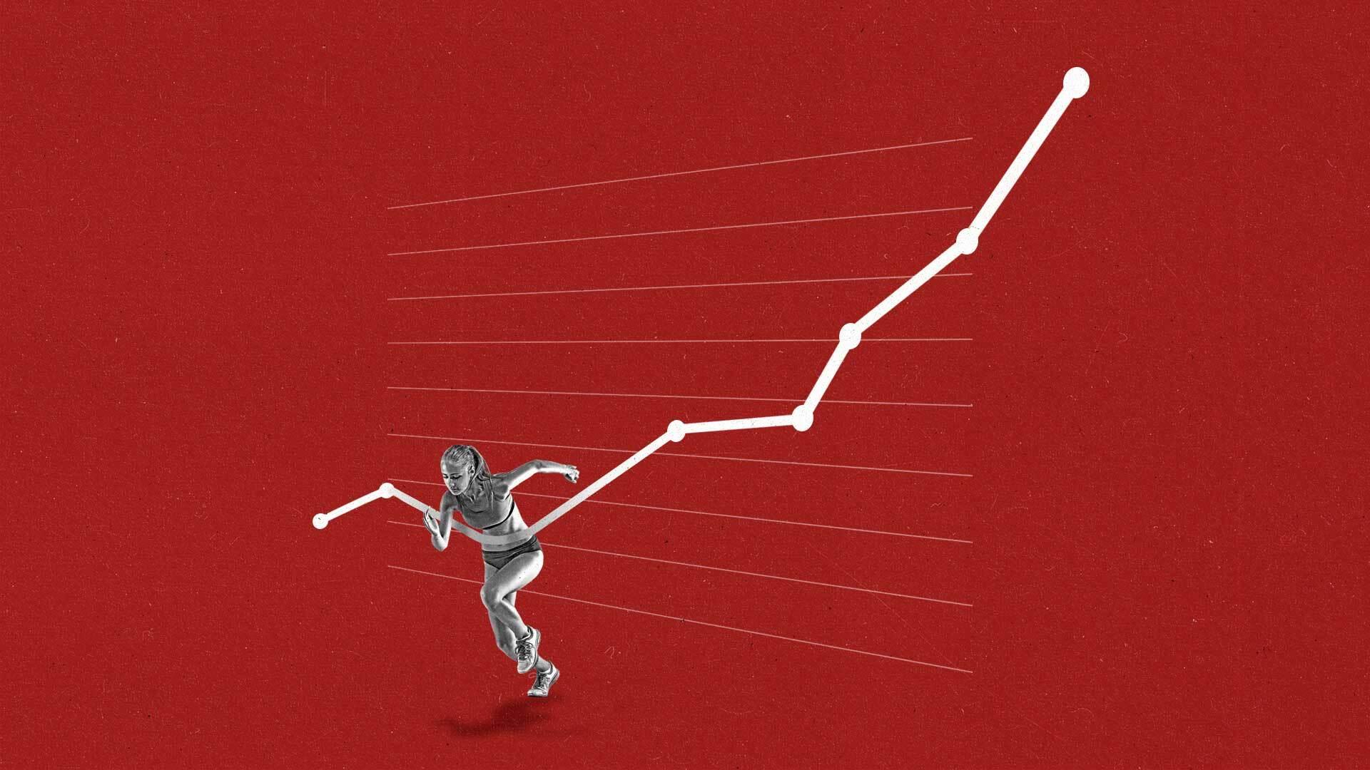 A female runner runs through an upwards trending line graph as if its a finish line.