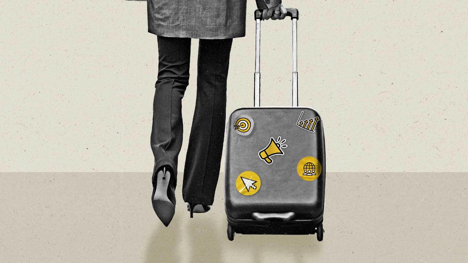 A woman pulls a travel luggage covered in stickers showing a cursor, a megaphone, a target, a globe, and a bar chart.