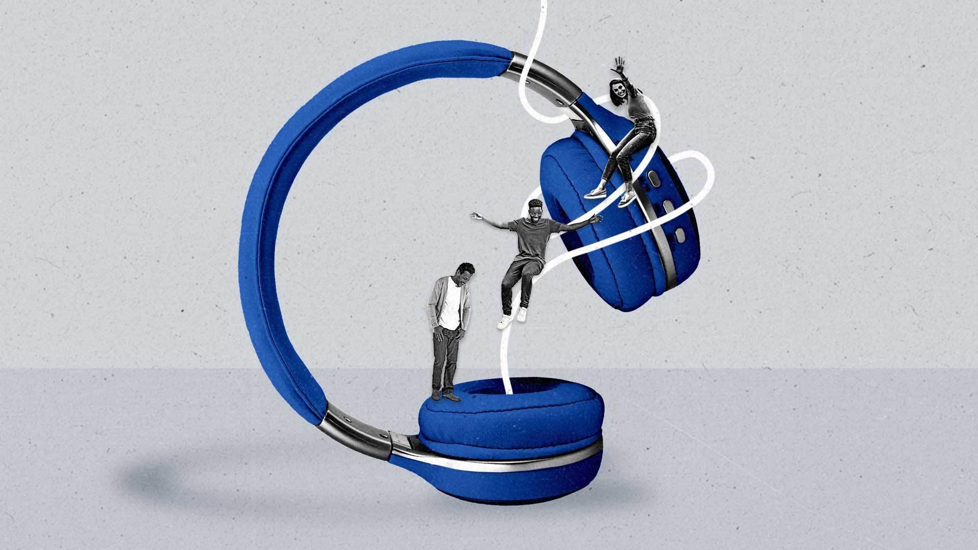 Two people happily slide down a wire into an oversized pair of headphones as another person looks on in delight.