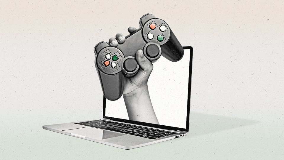A hand emerges out of the screen of a laptop holding a video game controller as the buttons change colors from orange to green to white.
