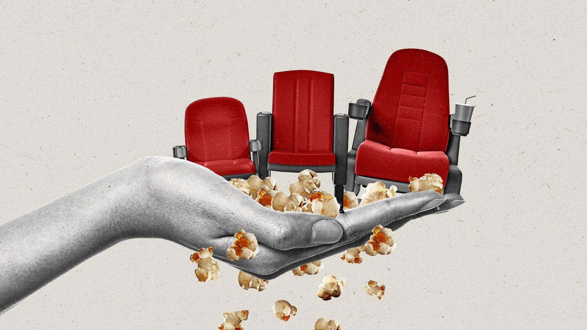 Popcorn spills from a hand holding three red movie theater seats of increasing height.