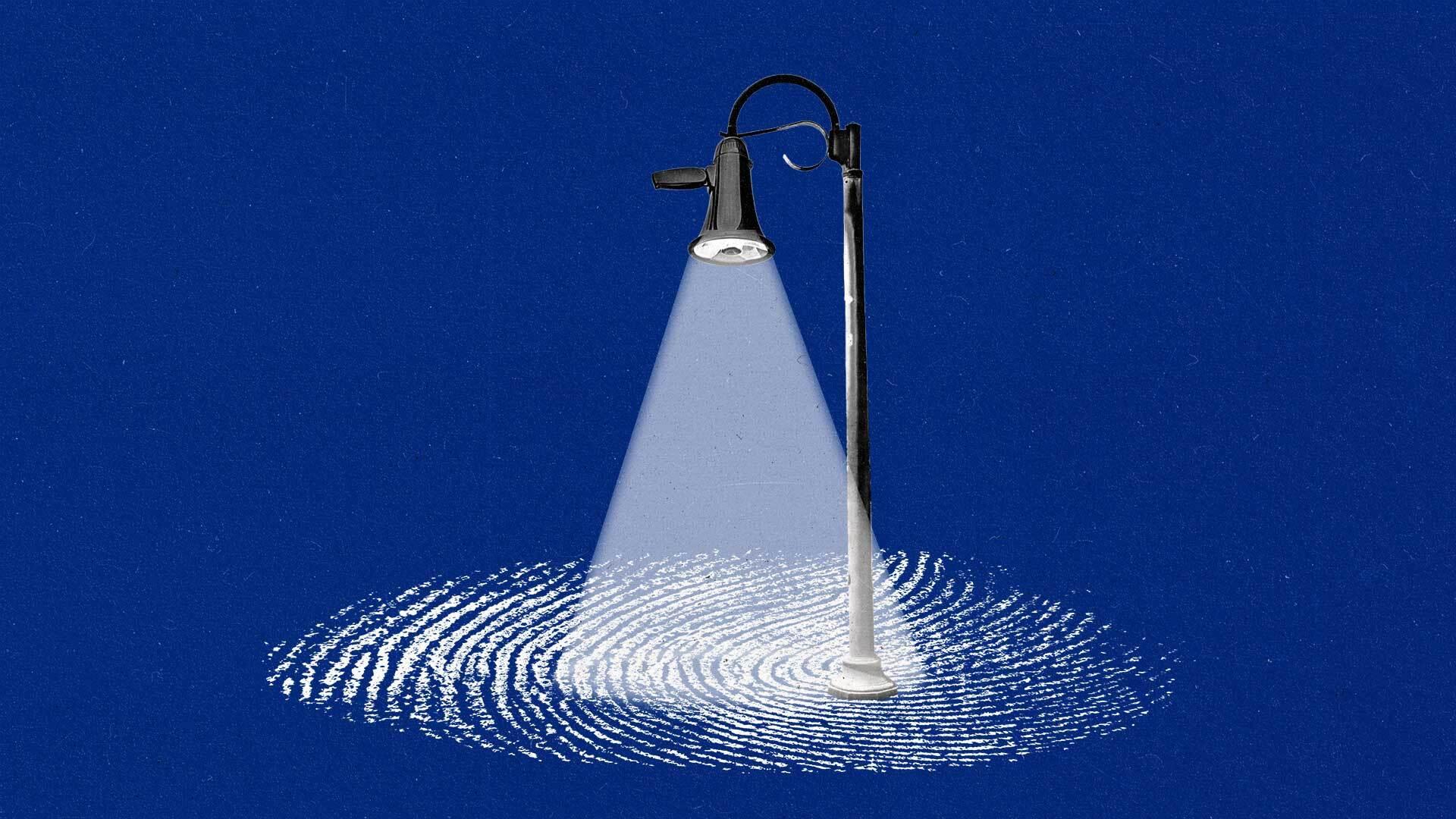 A streetlight with a megaphone as a lamp shines down on part of a large fingerprint.