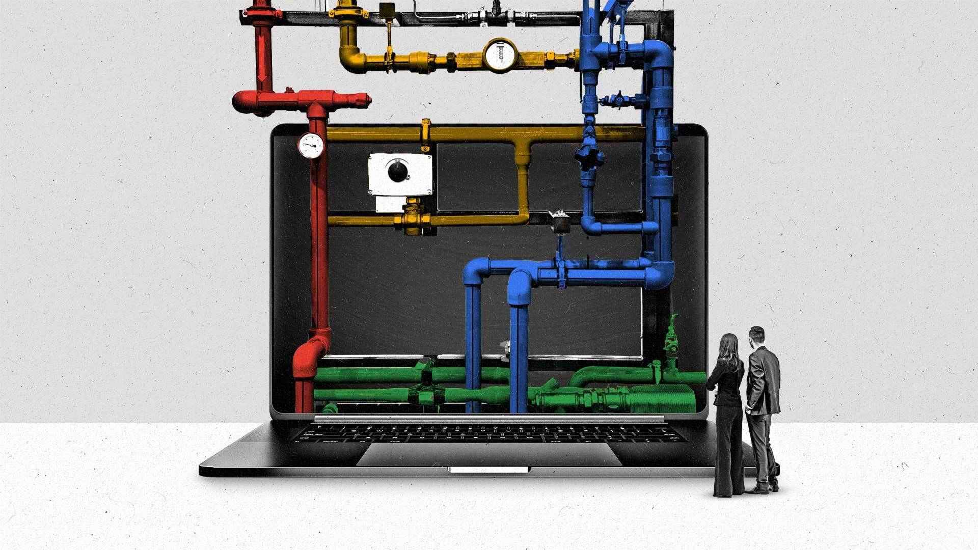 A series of multicolored pipes flow down into a laptop screen as two people watch.