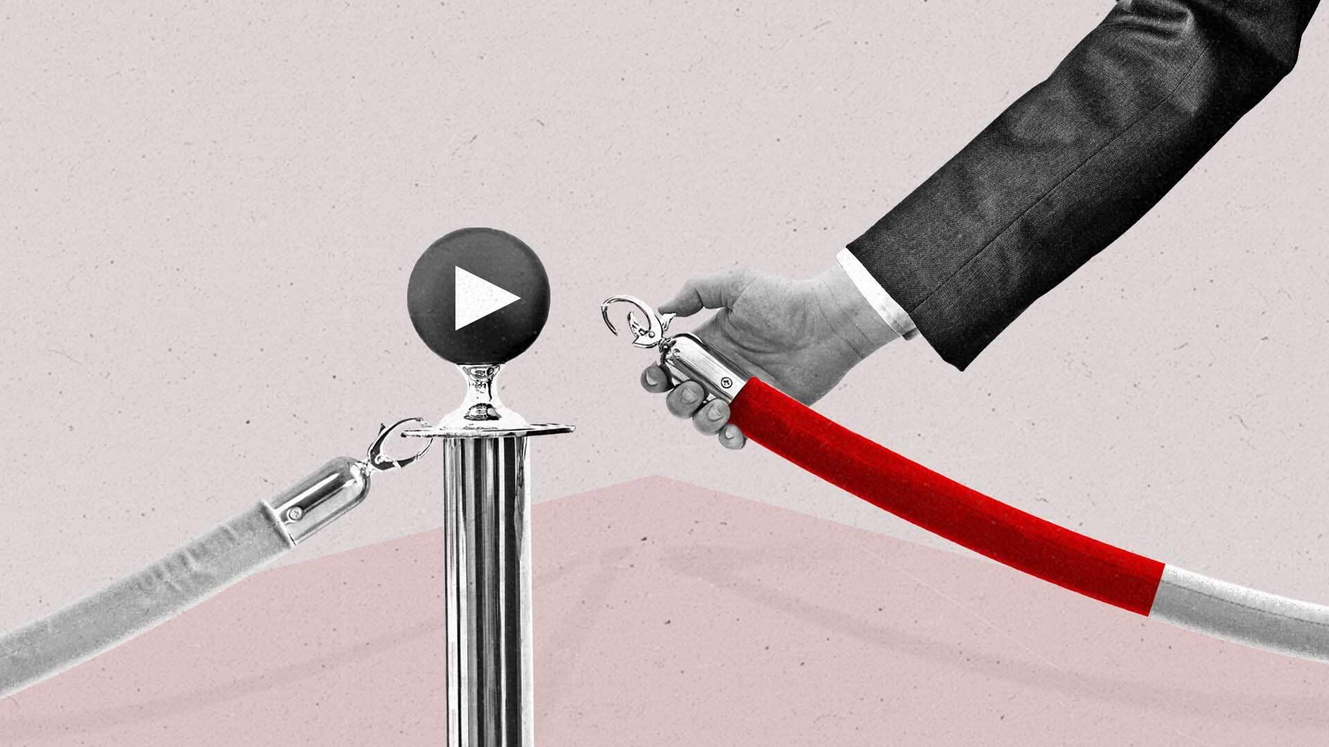 A hand unhooks a velvet rope from a post topped with a play button.