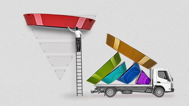 A man takes down the top of a marketing funnel from a wall. A nearby flatbed truck holds the other pieces of the marketing funnel.