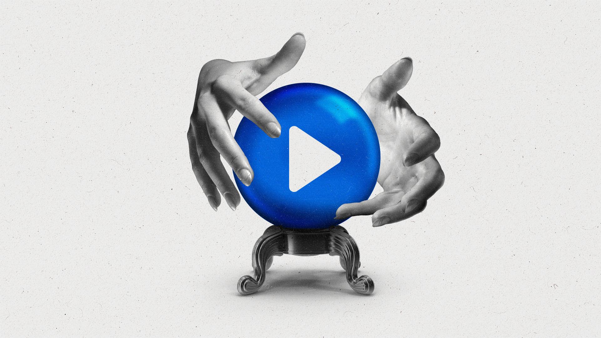 Two hands hover around a crystal ball with a video play button on it.