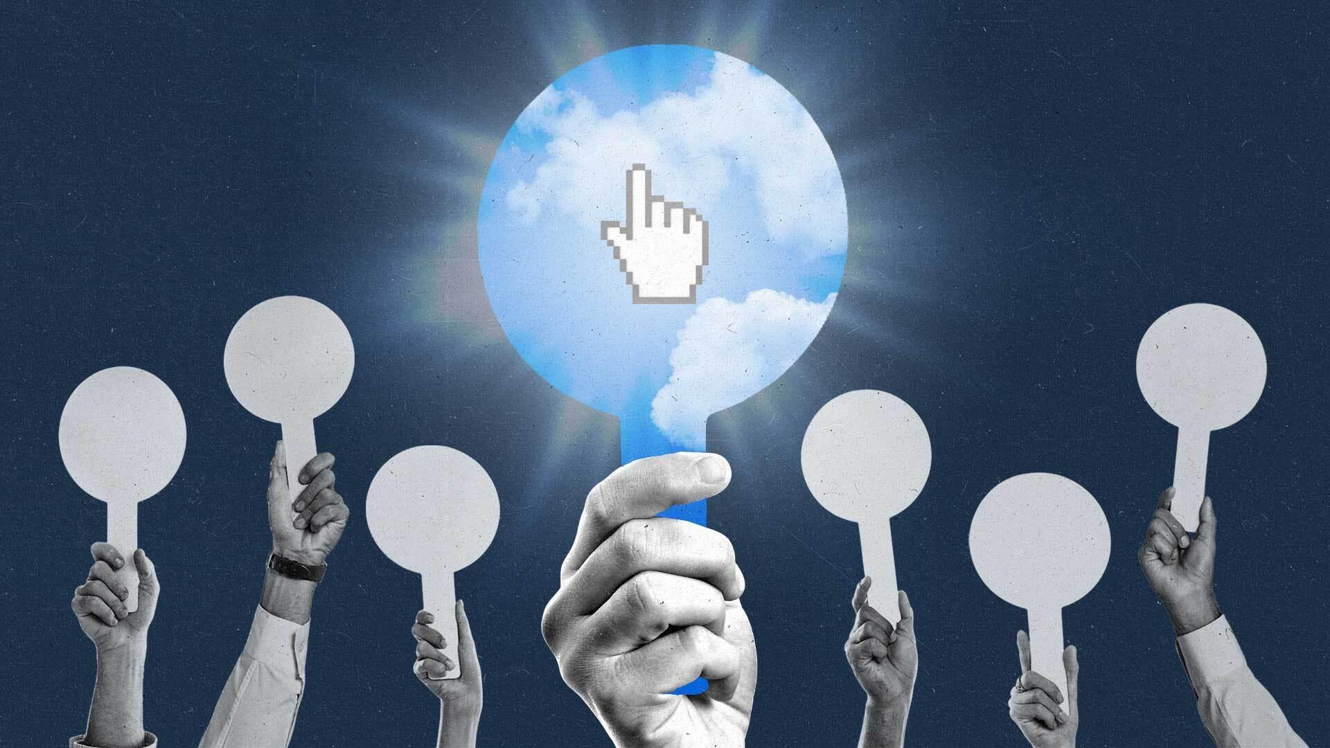 A hand holds up a paddle showing an open blue sky with a shining finger cursor.