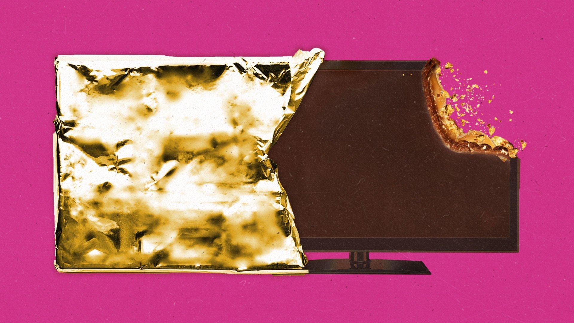 A chocolate LCD TV with a bite removed is peeking out of its gold foil wrapper.