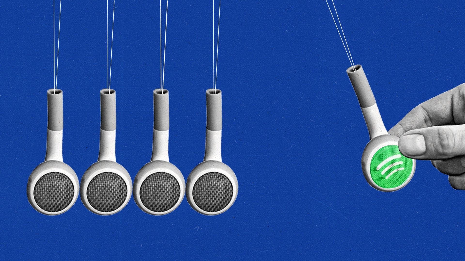 A hand pulls back an earbud with the Spotify logo within a Newton's Cradle containing four other hanging earbuds