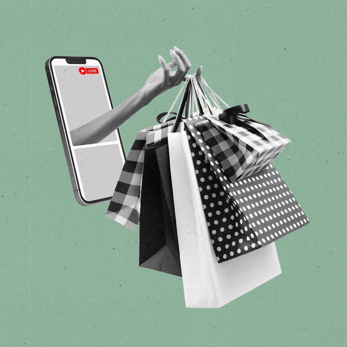 A hand protrudes out of a smart phone with a live recording holding shopping bags.