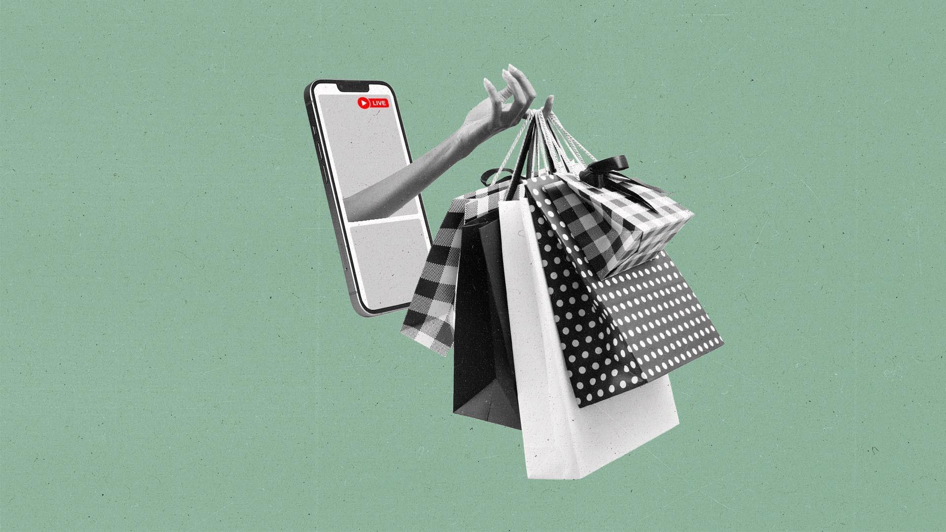 A hand protrudes out of a smart phone with a live recording holding shopping bags.
