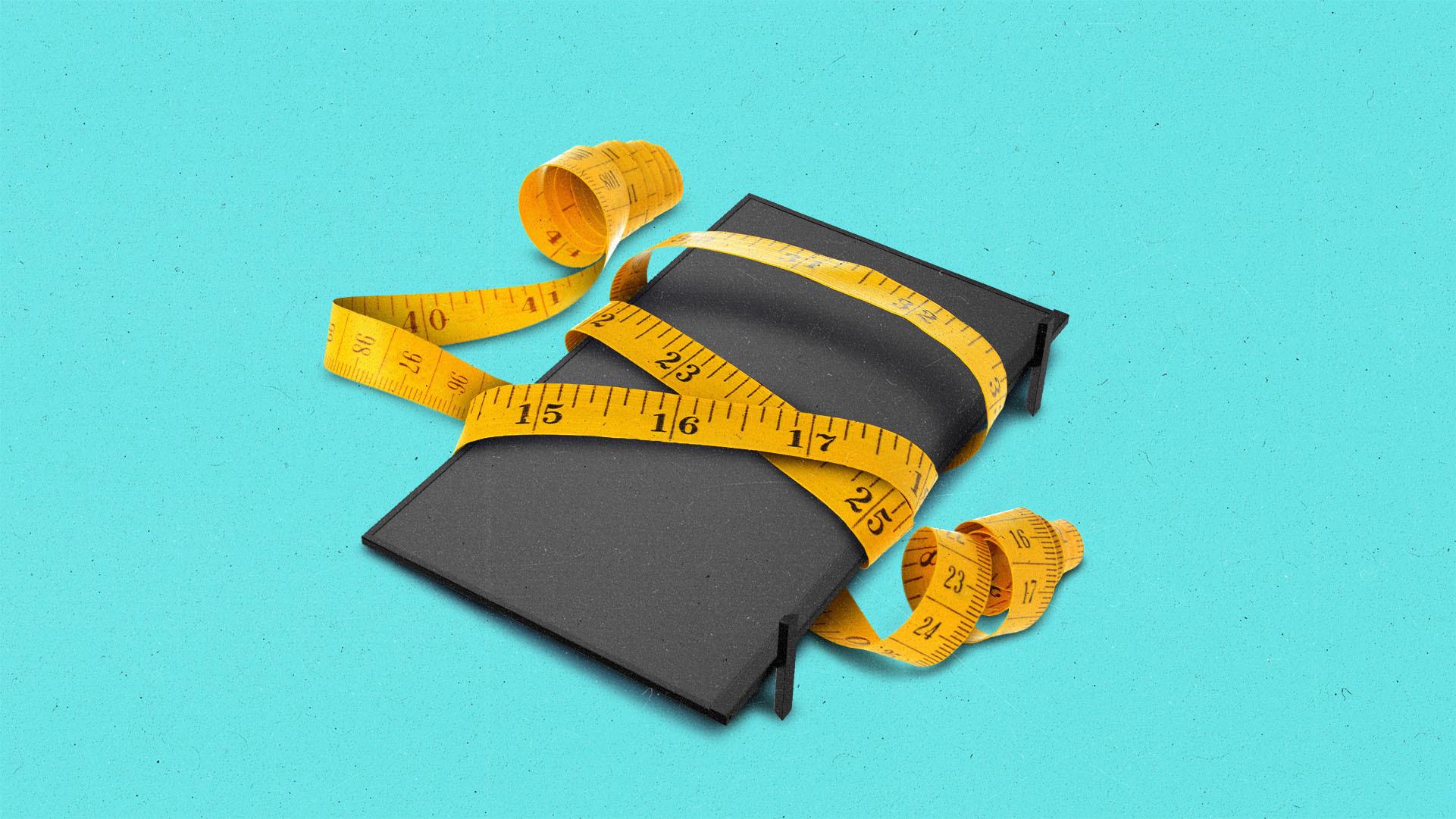 A measuring tape wrapped around a TV.