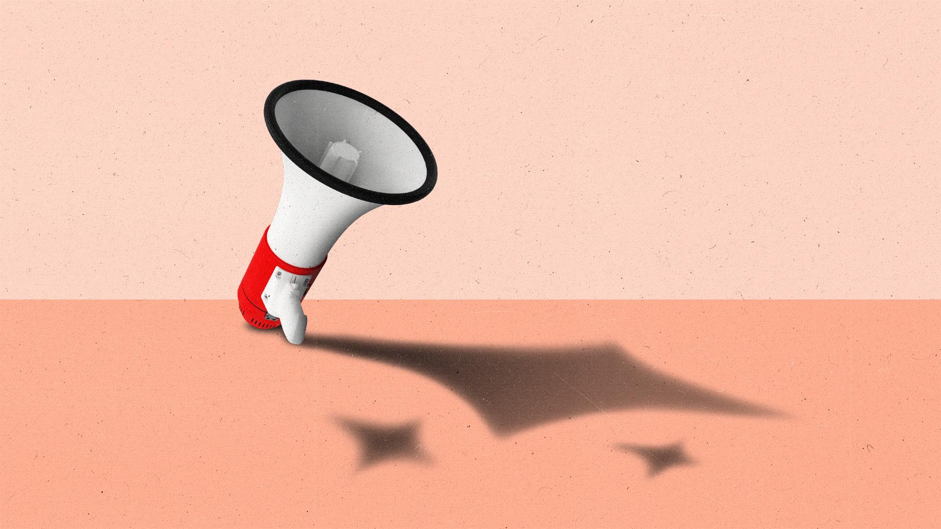 A megaphone casting a shadow shaped like an AI sparkle.