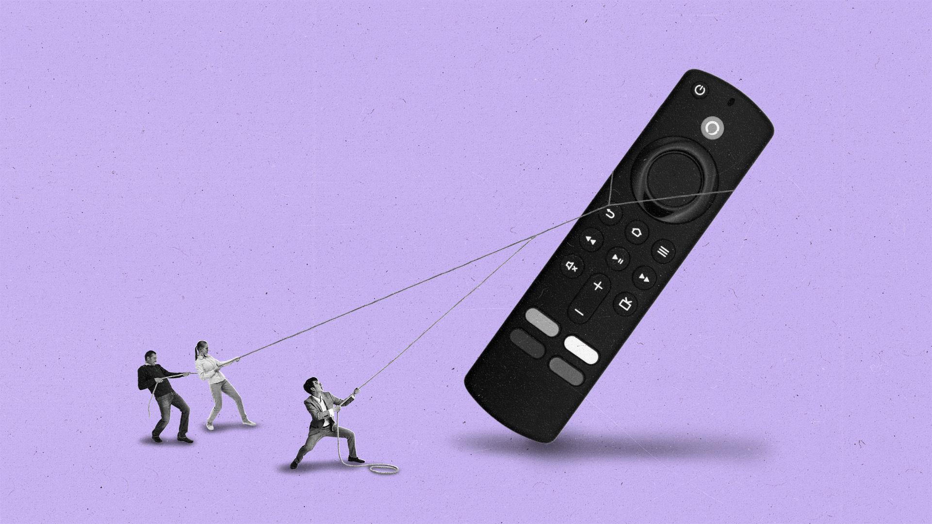 People pulling on ropes to lift up a giant streaming remote like a tower.