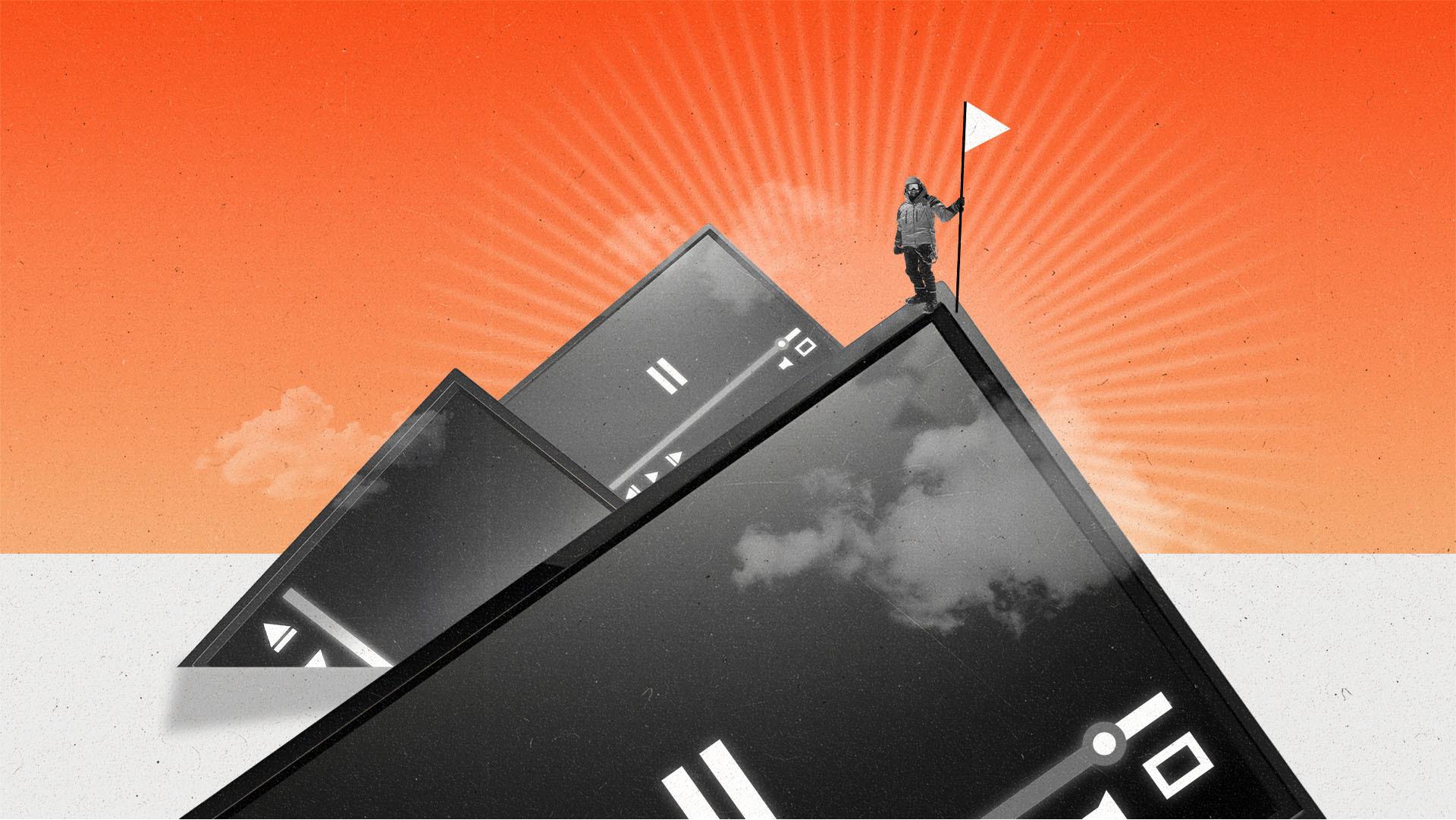 Climber plants a flag on the summit of a mountain made of TVs