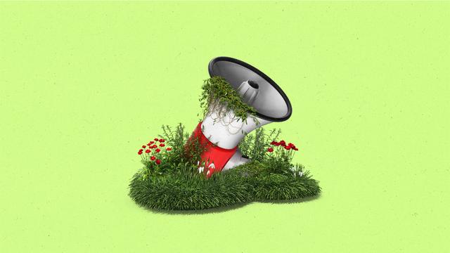 A megaphone overgrown with plants, flowers and ivy.