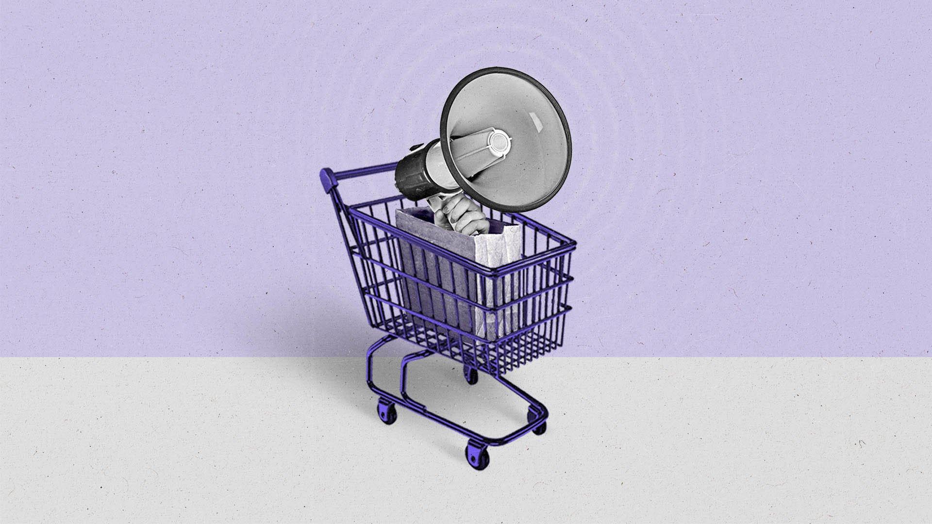 A hand holding a megaphone emerges from a paper bag within a purple shopping cart.