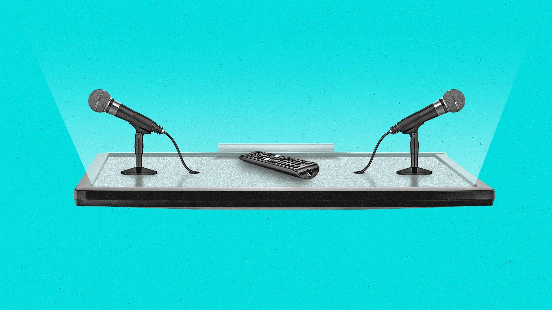 A streaming remote and two microphones sit on top of a connected TV as if it were a table.