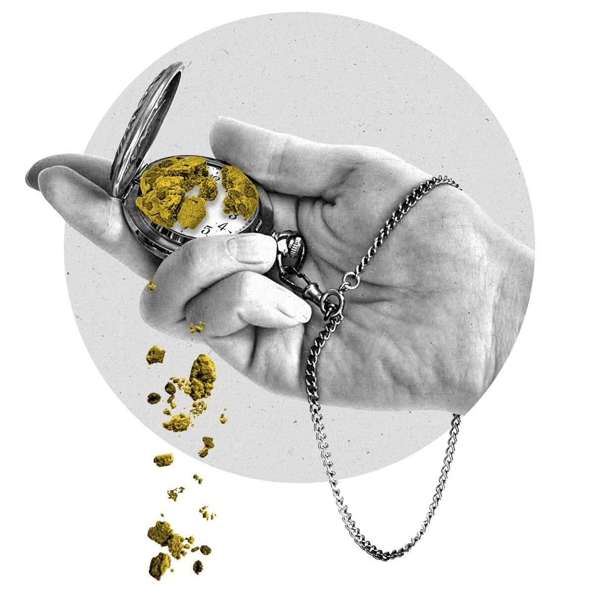 A hand holds a pocketwatch containing a crumbling cookie.