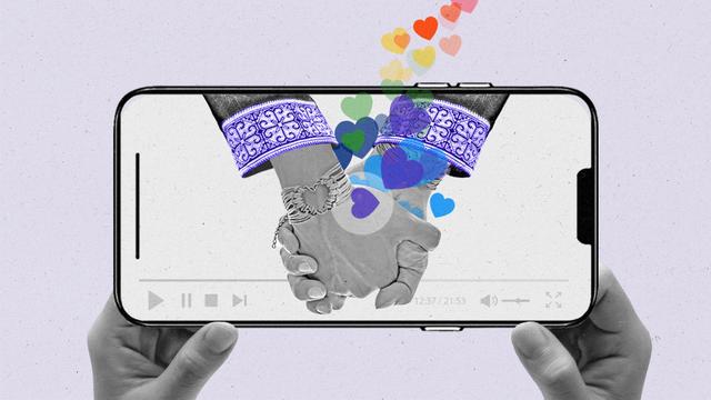 Two hands with traditional Thai sleeves embrace on a streaming smartphone as a rainbow of hearts emerge from between them.