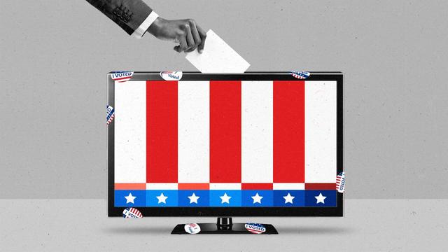 A hand deposits a ballot into the top of a LCD TV showing U.S. flag-colored bar pattern. The TV is covered with 'I Voted' stickers.