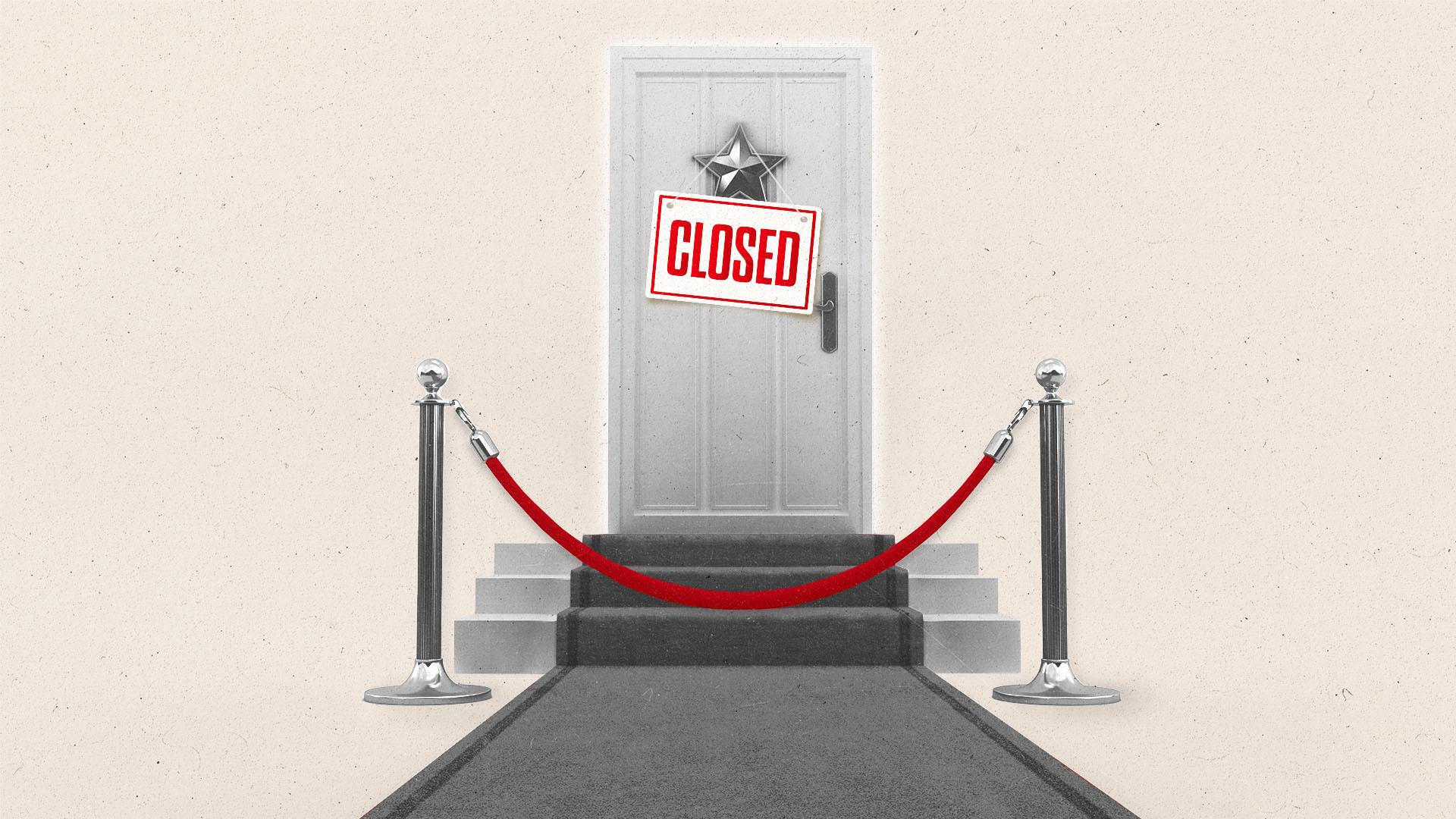 A red carpet leads to a roped-off door with a 'Closed' sign hanging off of a star.